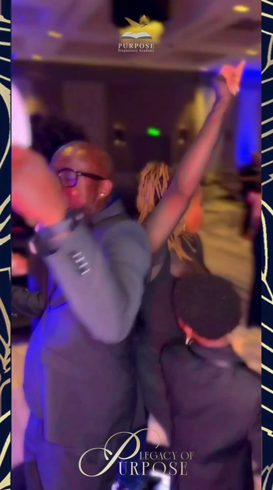 Guests raise their hands and celebrate beneath colorful dance-floor lighting during a 360 recording.